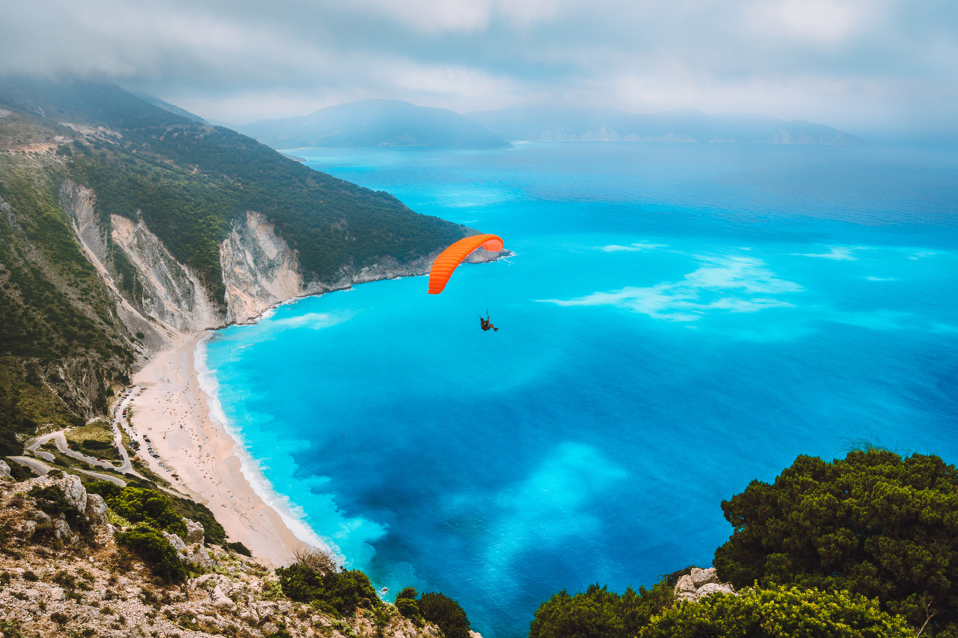 aerial-view-of-the-paraglider-flying-over-gorgeous-2021-08-26-20-17-20-utc