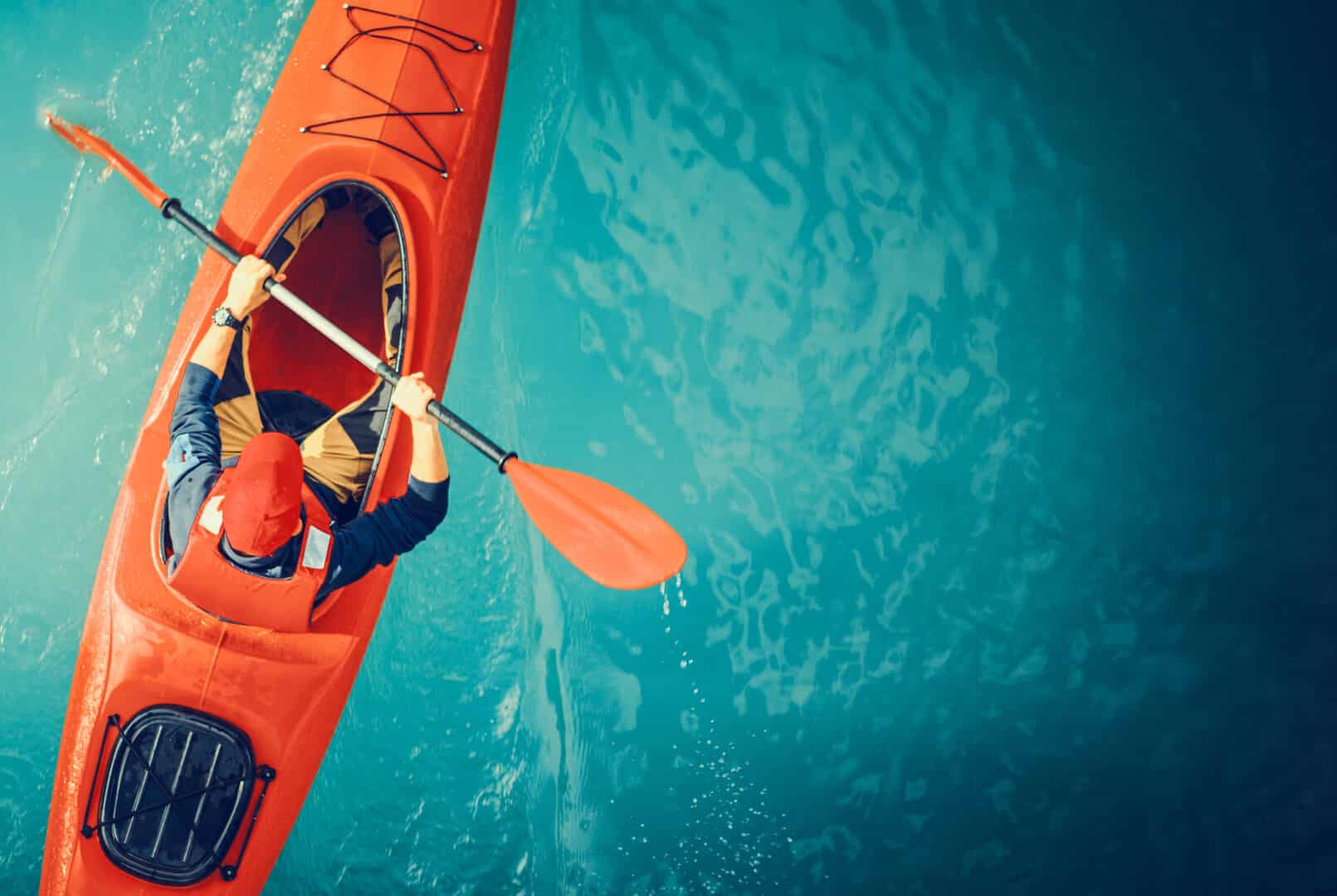 Kayaker,Lake,Tour,Aerial,Photo.,Red,Kayak,And,Caucasian,Paddling